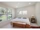 Bright bedroom with large windows, a comfortable bed, and light flooring at 513 Hand Ave, Sarasota, FL 34232