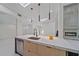 Modern kitchen with a large island, quartz countertops, and black cabinets at 513 Hand Ave, Sarasota, FL 34232