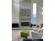 Spacious living room featuring a concrete fireplace and modern furniture at 513 Hand Ave, Sarasota, FL 34232