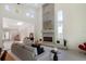 Open concept living room with a modern fireplace and ample natural light at 513 Hand Ave, Sarasota, FL 34232