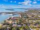 Stunning aerial view showcasing waterfront homes, a marina, and a picturesque heart-shaped island in the distance at 6721 30Th S St, St Petersburg, FL 33712