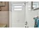 Well-lit bathtub/shower with white tile and shower-head at 6721 30Th S St, St Petersburg, FL 33712