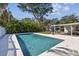 A refreshing pool with a patio and recreational area, ideal for outdoor entertaining and enjoying sunny days at 6721 30Th S St, St Petersburg, FL 33712