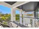 Private balcony with glass railings offering scenic views at 730 W Alda Ne Way, St Petersburg, FL 33704