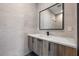 Stylish bathroom with wood vanity, quartz countertop, and black fixtures at 730 W Alda Ne Way, St Petersburg, FL 33704