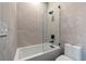 Clean bathroom with a bathtub, frameless glass shower and modern fixtures at 730 W Alda Ne Way, St Petersburg, FL 33704