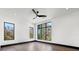 Bright bedroom with dark trim, hardwood floors and ceiling fan at 730 W Alda Ne Way, St Petersburg, FL 33704