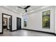 Spacious bedroom with dark trim, large windows, and tiled floors at 730 W Alda Ne Way, St Petersburg, FL 33704