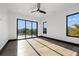 Bright bedroom with sliding glass doors leading to private balcony at 730 W Alda Ne Way, St Petersburg, FL 33704