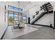 Modern dining area with large windows and high ceilings at 730 W Alda Ne Way, St Petersburg, FL 33704