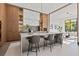 Modern kitchen with marble backsplash, stainless steel appliances, and an island at 730 W Alda Ne Way, St Petersburg, FL 33704