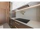Modern kitchen detail featuring a cooktop and range hood at 730 W Alda Ne Way, St Petersburg, FL 33704