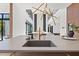 Modern kitchen sink and faucet with a large island at 730 W Alda Ne Way, St Petersburg, FL 33704