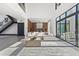 Open concept living room with sectional sofa, high ceilings, and modern kitchen at 730 W Alda Ne Way, St Petersburg, FL 33704