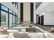 Sunlit living area featuring a modern fireplace and ample seating at 730 W Alda Ne Way, St Petersburg, FL 33704