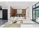 Bright living room with white sectional sofa and large windows at 730 W Alda Ne Way, St Petersburg, FL 33704
