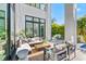 Spacious patio with comfortable seating and a view of the home's interior at 730 W Alda Ne Way, St Petersburg, FL 33704