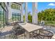 Outdoor dining area on a large patio with modern furniture at 730 W Alda Ne Way, St Petersburg, FL 33704