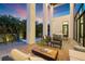 Evening view of a relaxing patio with seating near a pool at 730 W Alda Ne Way, St Petersburg, FL 33704
