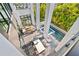 Elevated view of a luxurious patio with pool, dining area, and lounge furniture at 730 W Alda Ne Way, St Petersburg, FL 33704