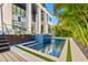 Luxury pool and spa with modern design, surrounded by lush landscaping at 730 W Alda Ne Way, St Petersburg, FL 33704