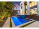 Night view of a modern pool and spa with lighting at 730 W Alda Ne Way, St Petersburg, FL 33704