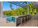 Covered pool bar with seating, perfect for entertaining at 730 W Alda Ne Way, St Petersburg, FL 33704