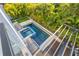 Inviting pool and spa surrounded by tropical landscaping at 730 W Alda Ne Way, St Petersburg, FL 33704