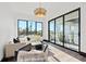 Light-filled sitting room with large windows and access to balcony at 730 W Alda Ne Way, St Petersburg, FL 33704