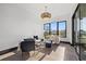 Bright sitting room features a stylish chandelier and access to a private balcony at 730 W Alda Ne Way, St Petersburg, FL 33704