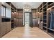 Large walk-in closet with custom built-ins and neutral tones at 730 W Alda Ne Way, St Petersburg, FL 33704