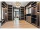 Spacious walk-in closet with ample shelving and modern lighting at 730 W Alda Ne Way, St Petersburg, FL 33704
