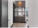 Modern wet bar with dark cabinetry and mirrored backsplash at 730 W Alda Ne Way, St Petersburg, FL 33704