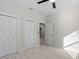 Well-lit bedroom with double door closets and light wood flooring at 7321 Mount Vernon Rd, Tampa, FL 33625