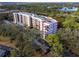 Aerial view showcasing condo building and surrounding landscape at 8186 Terrace Garden N Dr # 609, St Petersburg, FL 33709