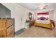 Main bedroom with wood floor, ceiling fan and dresser at 8348 Garrison Cir, Tampa, FL 33615