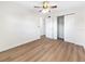 Well-lit bedroom with hardwood floors and ceiling fan at 8719 92Nd Ter, Seminole, FL 33777