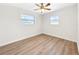 Bright bedroom with new flooring and ceiling fan at 8719 92Nd Ter, Seminole, FL 33777