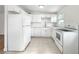 Modern kitchen with white cabinets and new appliances at 8719 92Nd Ter, Seminole, FL 33777