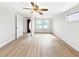 Bright living room featuring hardwood floors and ceiling fan at 8719 92Nd Ter, Seminole, FL 33777