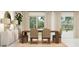 Elegant dining room with a large table and access to backyard at 10206 Alder Green Dr, Riverview, FL 33578