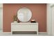 Elegant entryway with console table and large round mirror at 10206 Alder Green Dr, Riverview, FL 33578