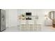 Modern kitchen with white cabinets and large island at 10206 Alder Green Dr, Riverview, FL 33578