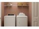 Clean laundry room with washer, dryer, and shelving at 10206 Alder Green Dr, Riverview, FL 33578