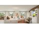 Bright and airy living room with sectional sofa and built-in shelving at 10206 Alder Green Dr, Riverview, FL 33578