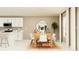 Modern kitchen with island, white cabinets, and stainless steel appliances at 10264 Alder Green Dr, Riverview, FL 33578