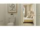 Bathroom with toilet and view into bedroom at 11729 71St E Ave, Palmetto, FL 34221