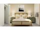 Bedroom with light wood bed frame and green nightstands at 11729 71St E Ave, Palmetto, FL 34221