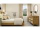 Bedroom with light wood bed frame and dresser at 11729 71St E Ave, Palmetto, FL 34221
