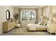 Bright bedroom with king-size bed and ample natural light at 11729 71St E Ave, Palmetto, FL 34221